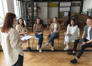 medium-shot-people-sitting-chairs